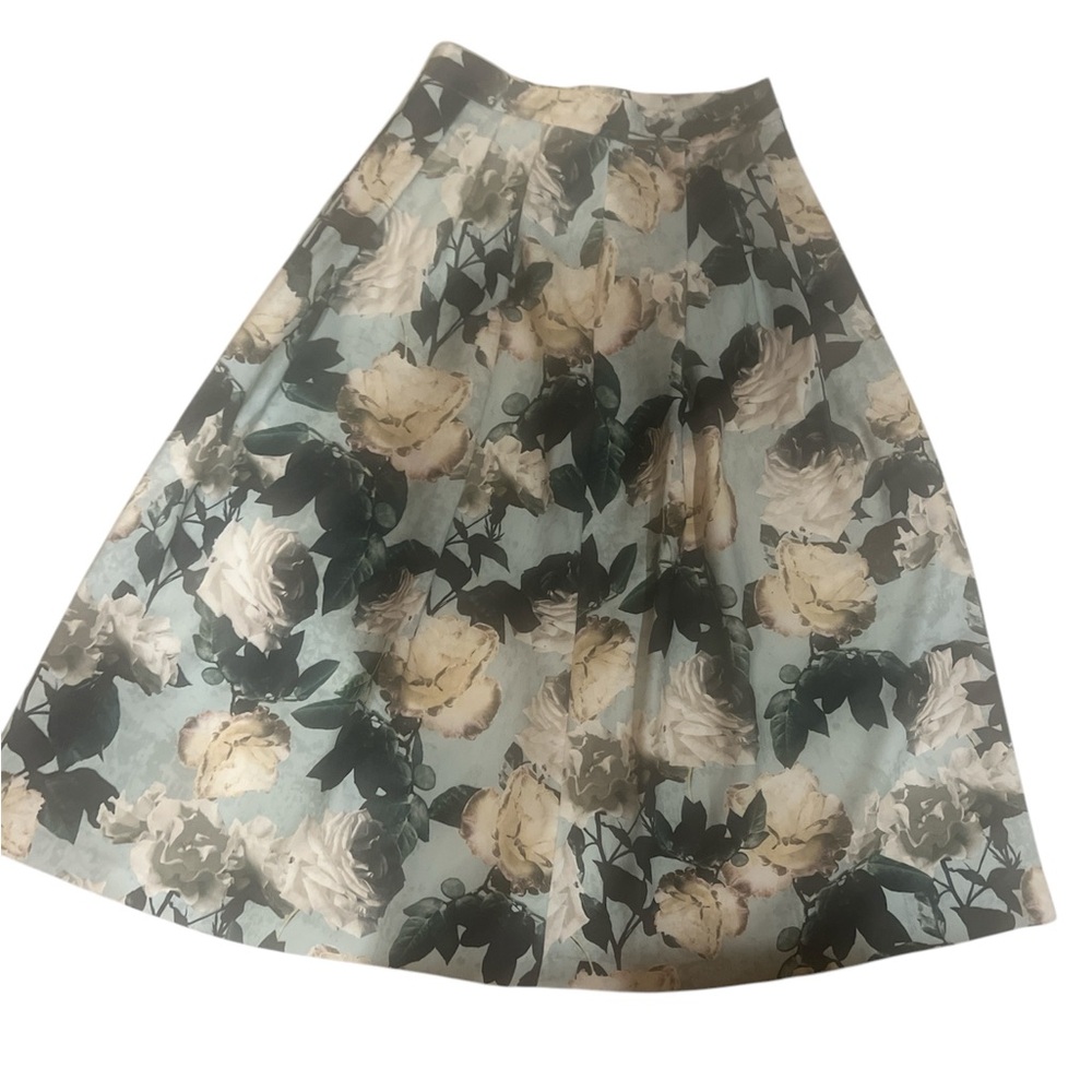 H&M midi length skirt pleated floral skirt pale blue background garden party